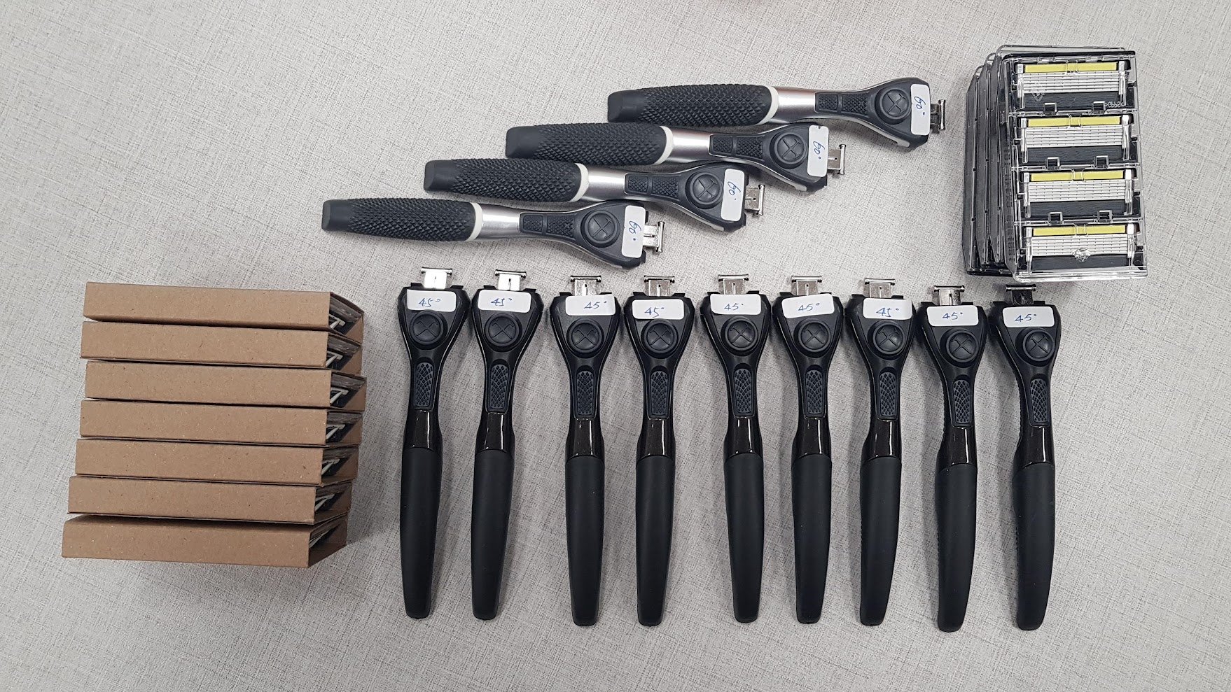 Zuckerim prototype handles labeled by grip angle, with blade cartridges